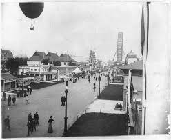 The Midway Plaisance with balloon and Ferris Wheel in the distance.