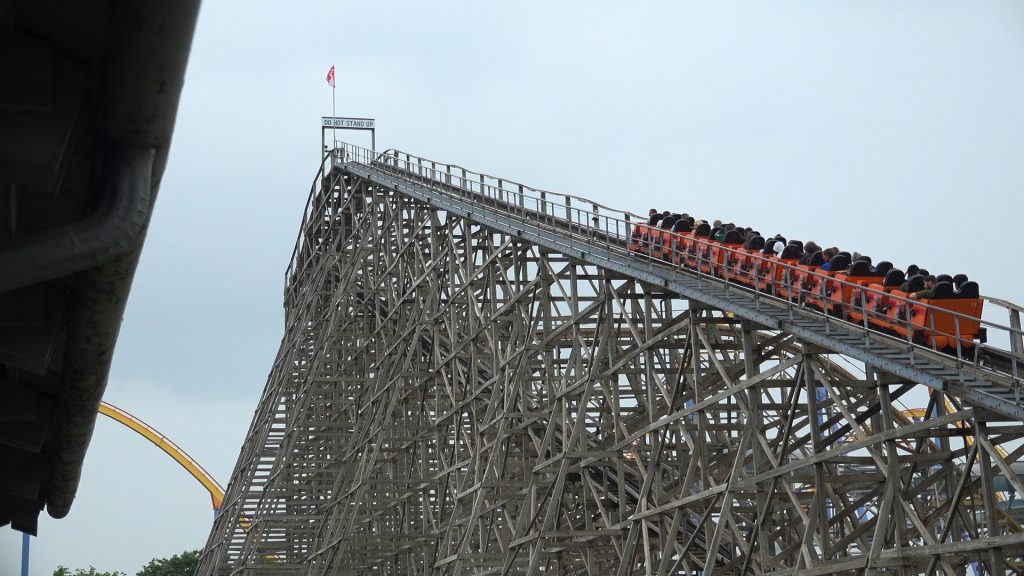 Minebuster's lift hill with the orange train ascending.