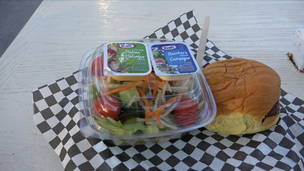 A burger and salad from Coasters Diner.