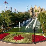 International Street including Wonder Mountain, the Royal Fountain, trees, and rides.