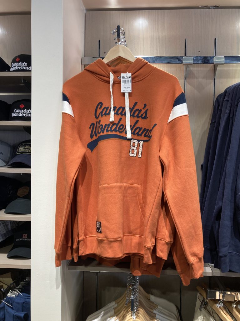 Orange hoodie with blue text.