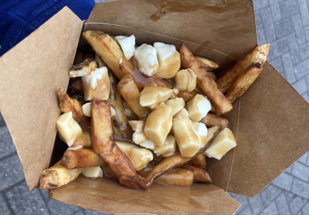 Poutine with fresh cut fries and cheese curds.