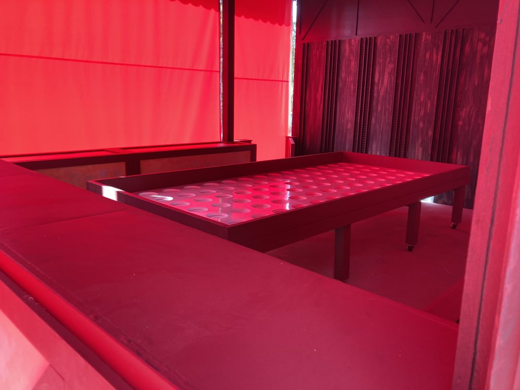 Interior of the games stall by Krachenwagen, with table.