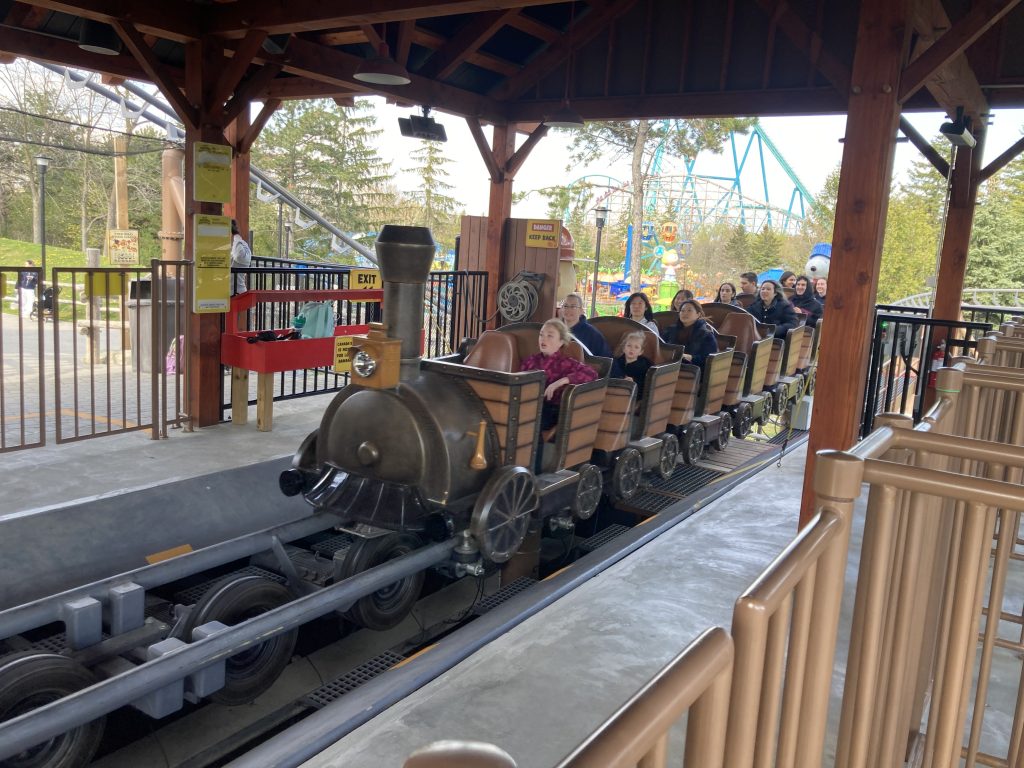 Snoopy's Racing Railway zooming through its station.