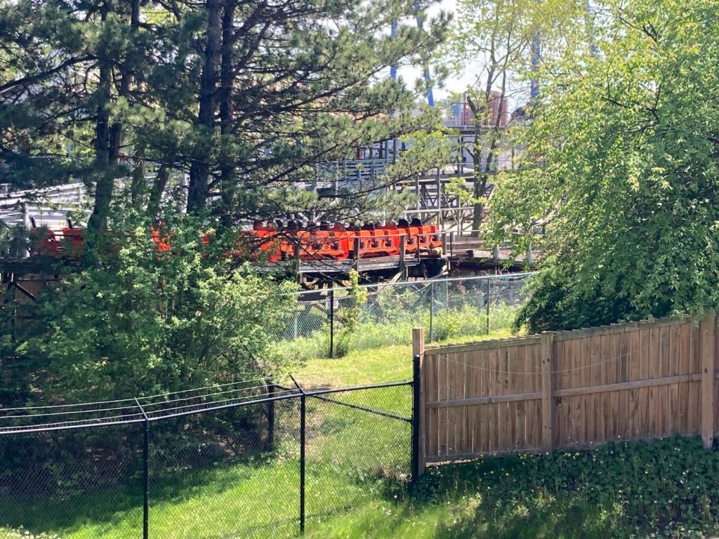 Minebuster's orange train approaching its lift hill.