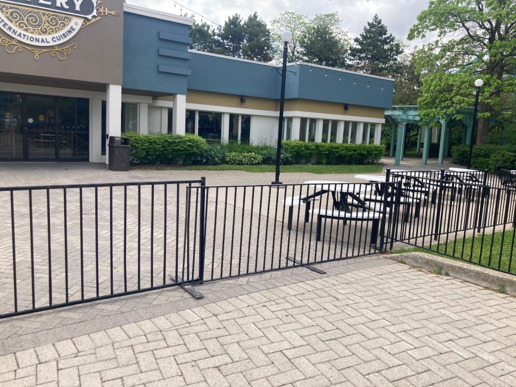 Grande World Eatery and its patios, fenced off.