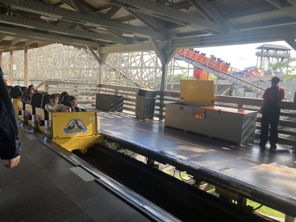 Minebuster's station, with a train entering as another is on the lift.
