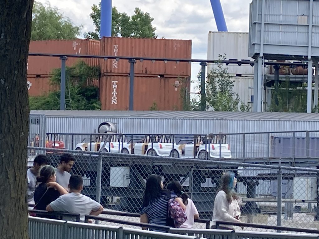 White train running on Backlot Stunt Coaster.