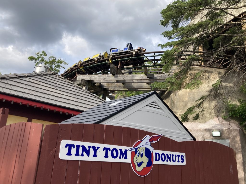 Tiny Tom Donuts' back area, with Thunder Run zooming by in the background.