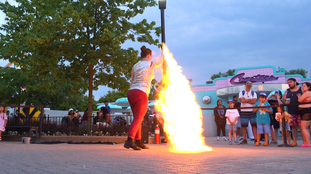 Scarlet summons a large flame.