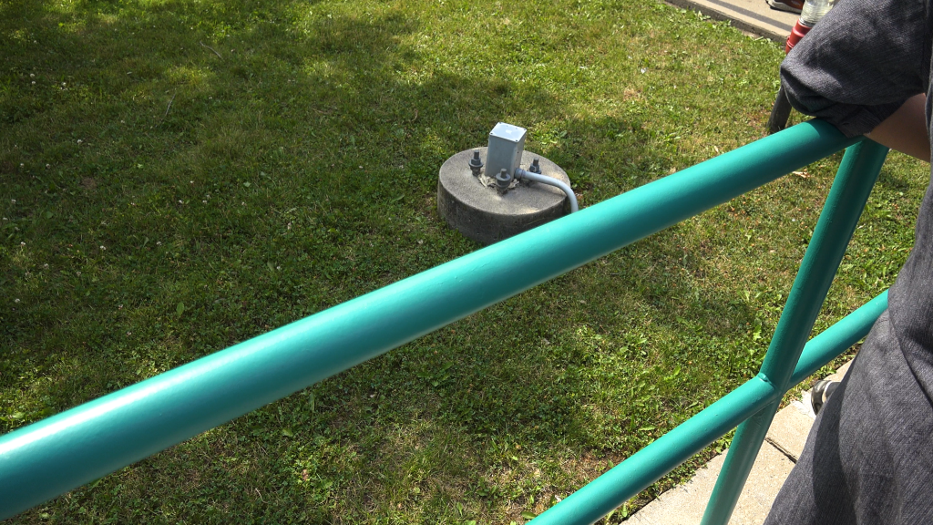 Green queue railings.