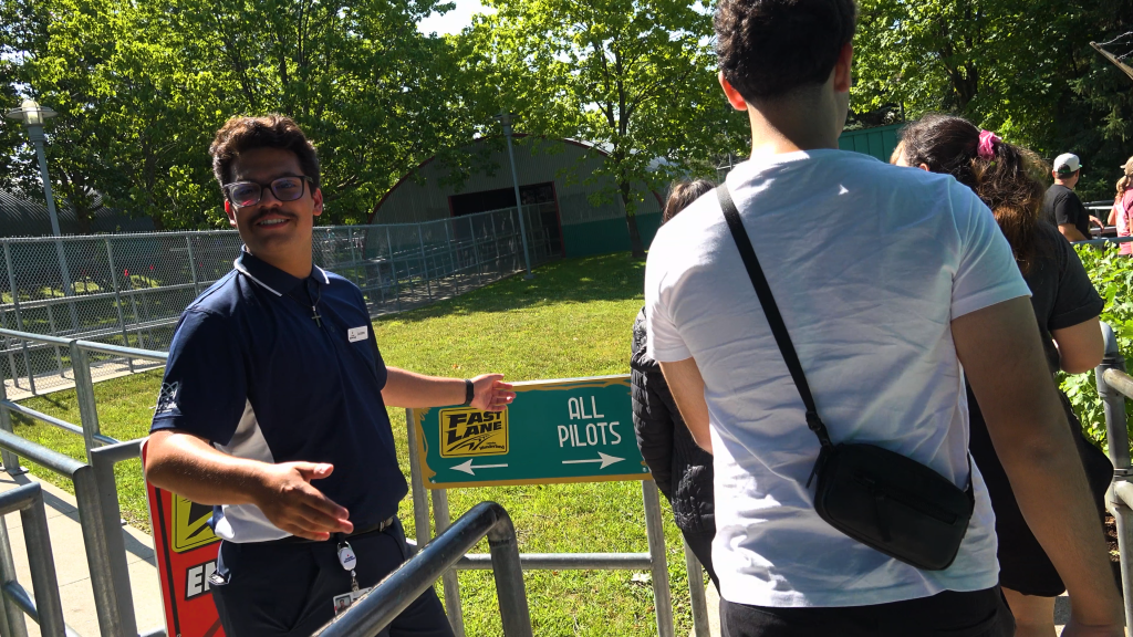 Sign directing guests to Fast Lane or "All Pilots" queues.