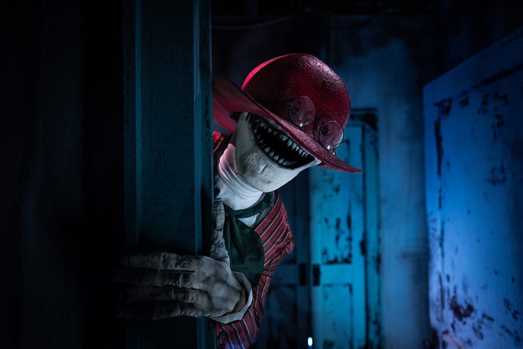 The Crooked Man peeking out a door.