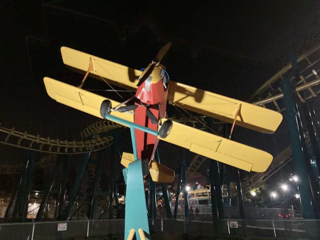 The DareDeviler plane lit up at night.