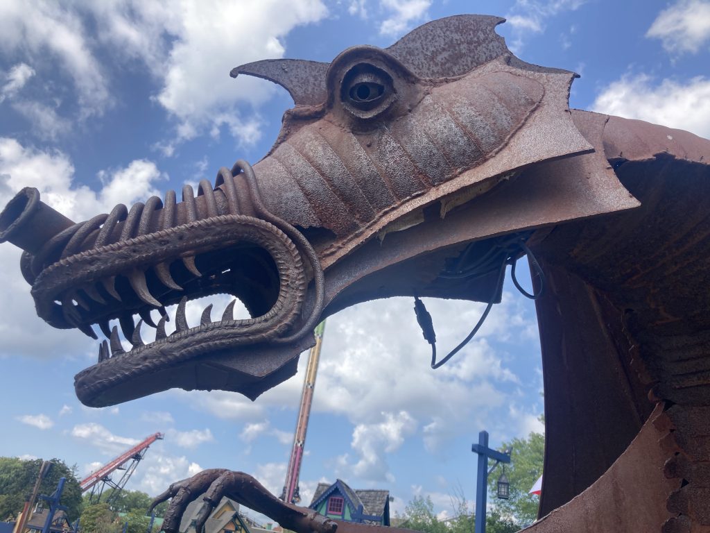 Wire hanging down from Dwayne's jaw.