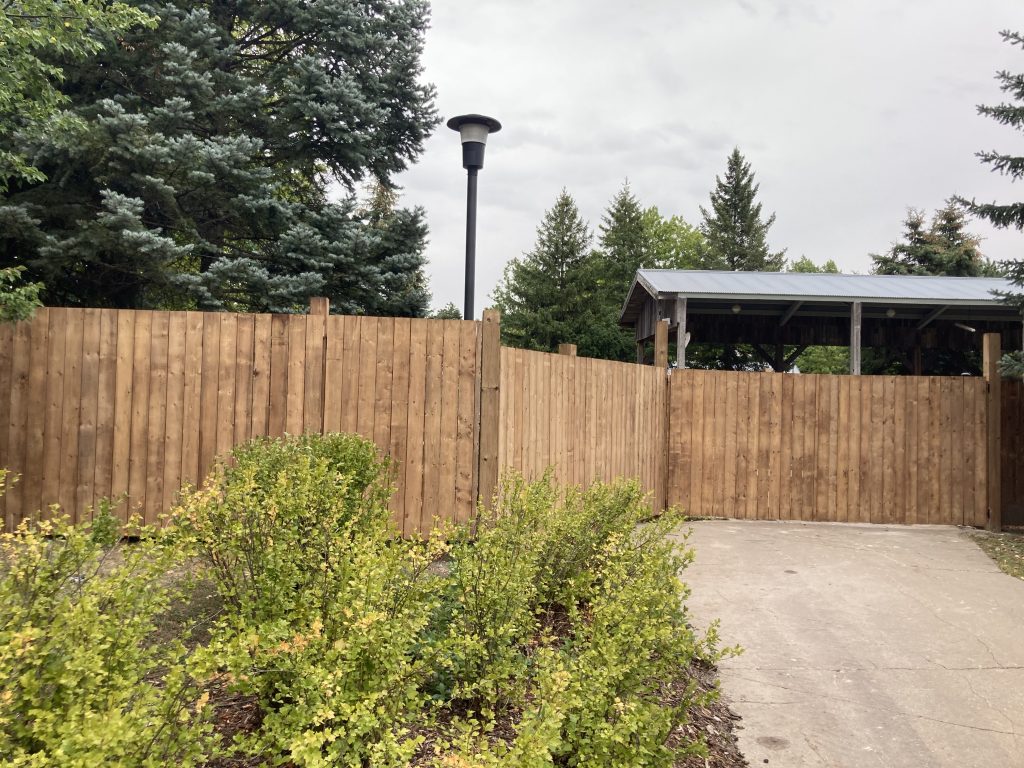 Wooden fence bordering Time Warp's former exit.