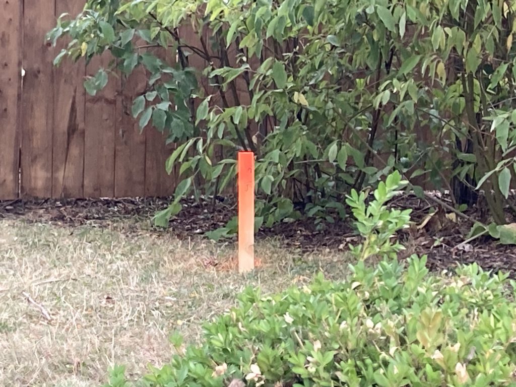 A stake in the ground around Time Warp's land.