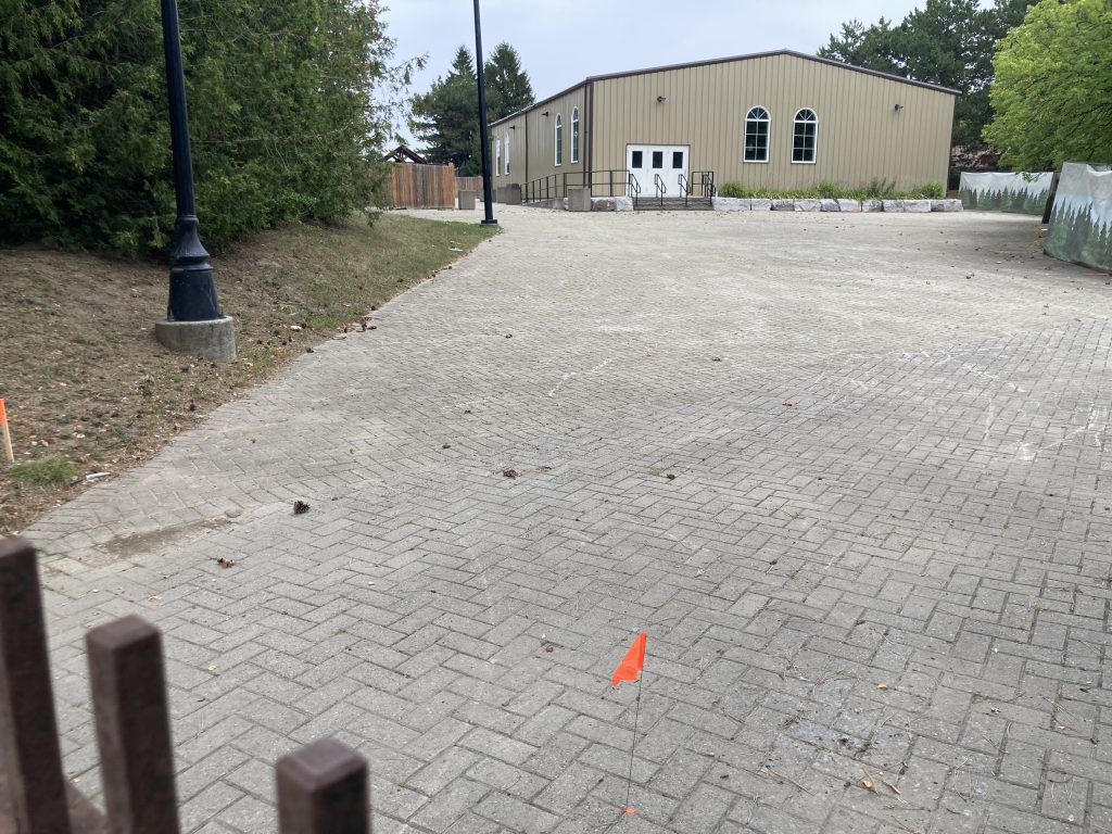 Flags in the ground around Kingswood's event building.