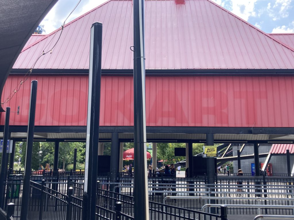 Faded Go Kart lettering visible on the back of Titan's queue building.