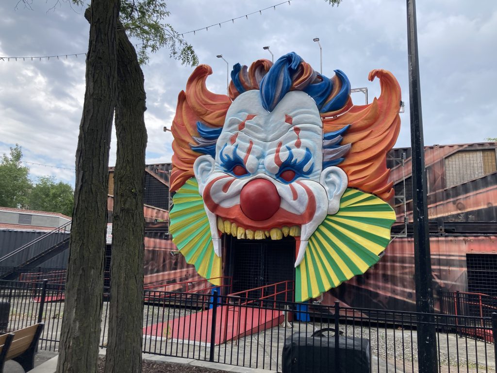 Decorative clown face at the entrance to Maison Rouge.