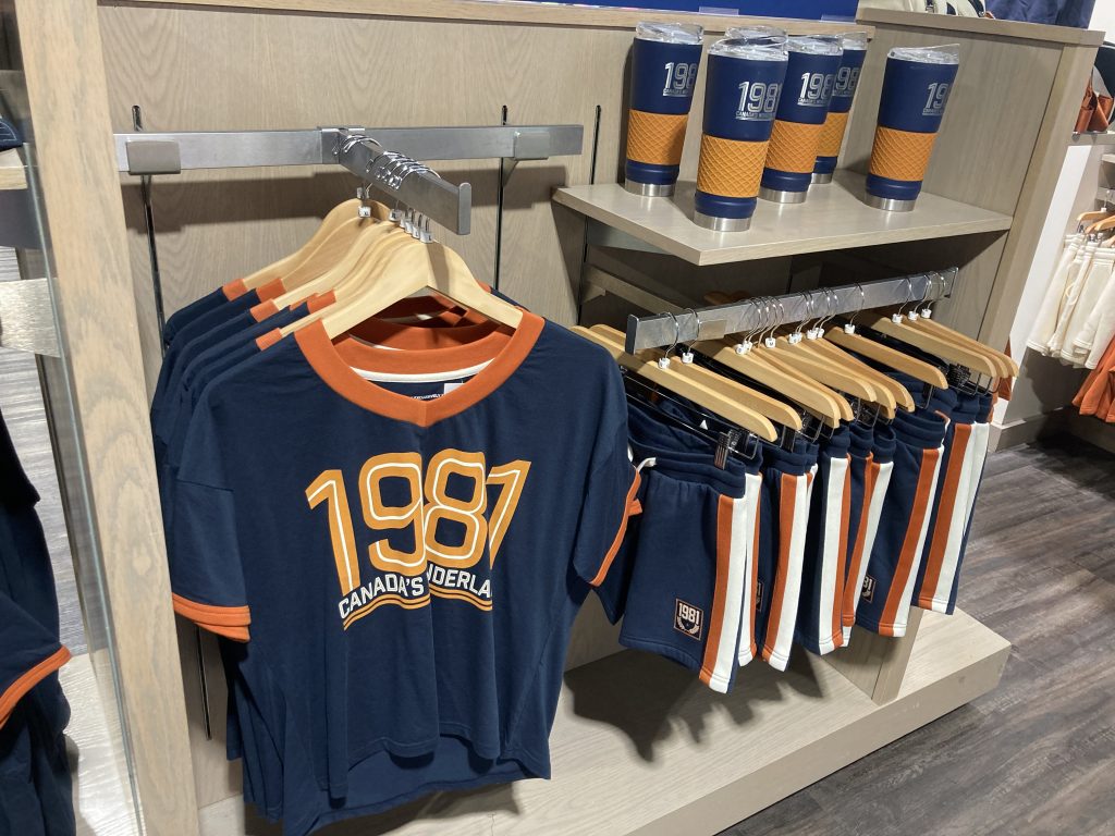 Varsity style shirt, shorts, and cup.